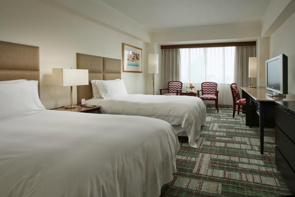 ฮาวาร์ด พลาซ่า โฮเต็ล Hotel เกาสง ห้อง รูปภาพ A room at the hotel