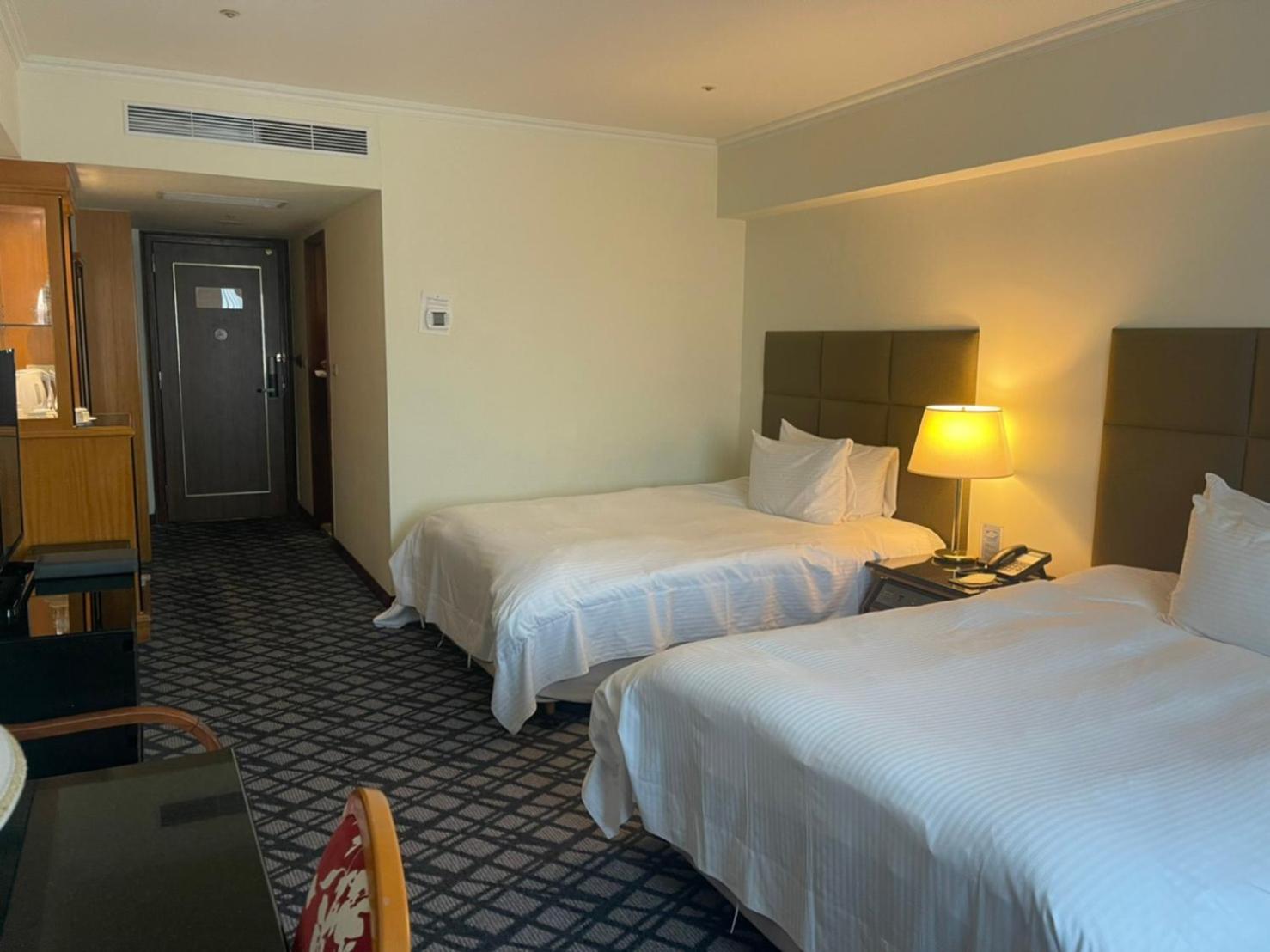 ฮาวาร์ด พลาซ่า โฮเต็ล Hotel เกาสง ห้อง รูปภาพ A room at the hotel